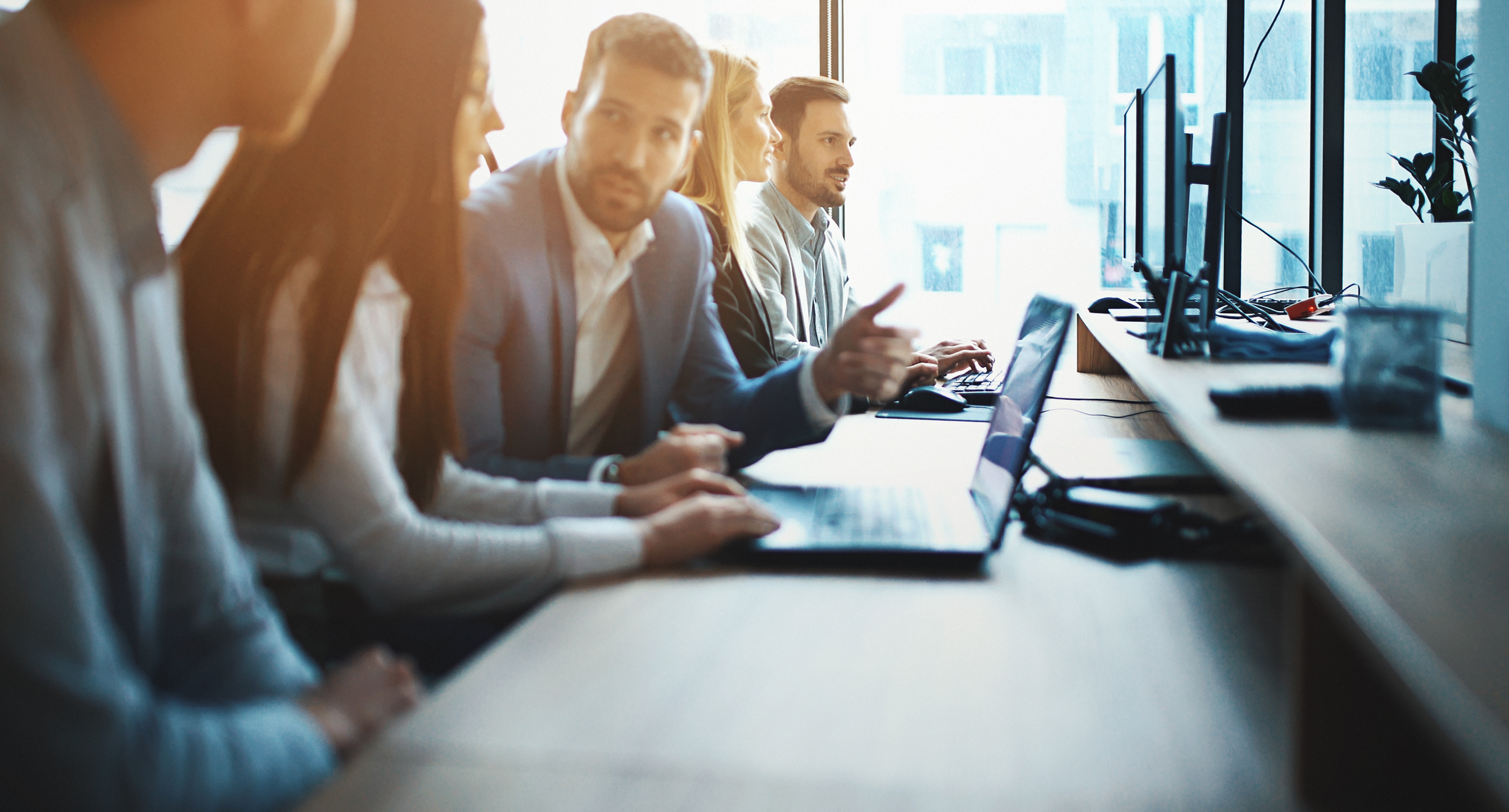 Two professionals discussing and sharing contact details